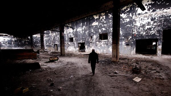 Ivanko Jankovic, a former employee, visits the site of the devastated Viskoza factory, once a proud symbol of Serbian industry, on March 5, 2014, in Loznica, western Serbia - Sputnik International