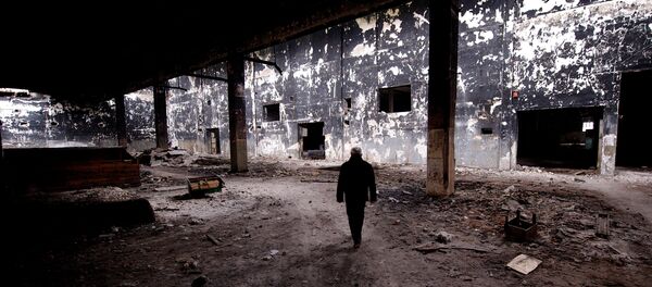 Ivanko Jankovic, a former employee, visits the site of the devastated Viskoza factory, once a proud symbol of Serbian industry, on March 5, 2014, in Loznica, western Serbia - Sputnik International