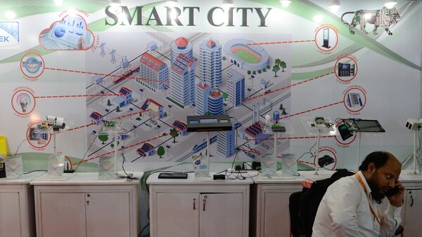 An Indian delagate talks on a phone during the Smart Cities India 2016 expo in New Delhi on May 12, 2016 - Sputnik International