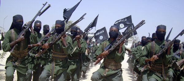 In this Thursday, Feb. 17, 2011 file photo, al-Shabab fighters march with their weapons during military exercises on the outskirts of Mogadishu, Somalia - Sputnik International