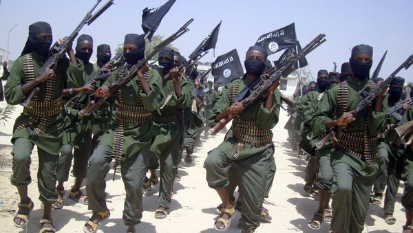 In this Thursday, Feb. 17, 2011 file photo, al-Shabab fighters march with their weapons during military exercises on the outskirts of Mogadishu, Somalia - Sputnik International
