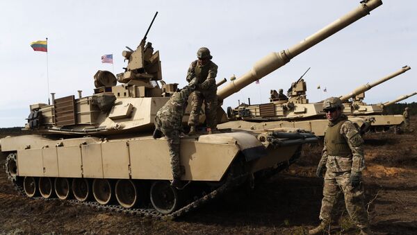 U.S. soldiers from the 2nd Battalion, 1st Brigade Combat Team, 3rd Infantry Division at the M1A2 Abrams battle tank during a military exercise at the Gaiziunu Training Range in Pabrade some 60km.(38 miles) north of the capital Vilnius, Lithuania - Sputnik International