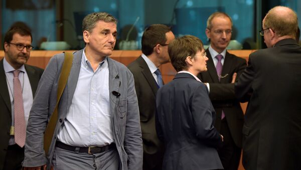 Greece's finance Minister Euclid Tsakalotos arrives at a Euro zone finance ministers meeting to discuss whether Greece has passed sufficient reforms to unblock new loans and how international lenders might grant Athens debt relief, in Brussels, Belgium May 24, 2016. - Sputnik International