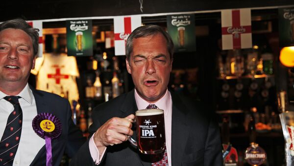 In this Friday, May 23, 2014 file photo, Nigel Farage, leader of Britain's United Kingdom Independence Party (UKIP) enjoys a pint of beer in South Benfleet, England. - Sputnik International