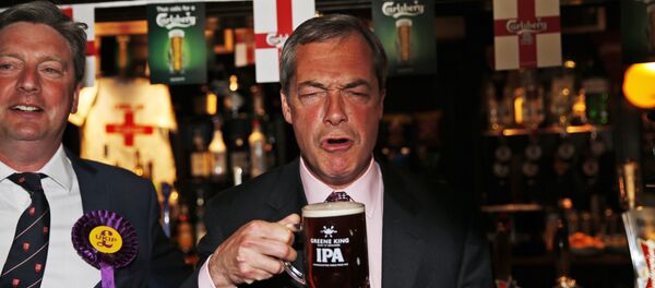 In this Friday, May 23, 2014 file photo, Nigel Farage, leader of Britain's United Kingdom Independence Party (UKIP) enjoys a pint of beer in South Benfleet, England. In this Friday, May 23, 2014 file photo, Nigel Farage, leader of Britain's United Kingdom Independence Party (UKIP) enjoys a pint of beer in South Benfleet, England. - Sputnik International