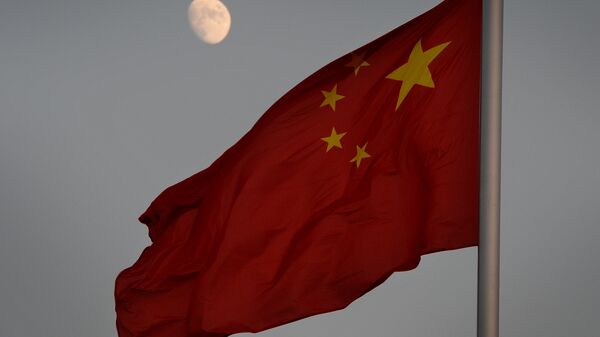 The Chinese flag is seen in front of a view of the moon at Tiananmen Square in Beijing on December 13, 2013 - Sputnik International