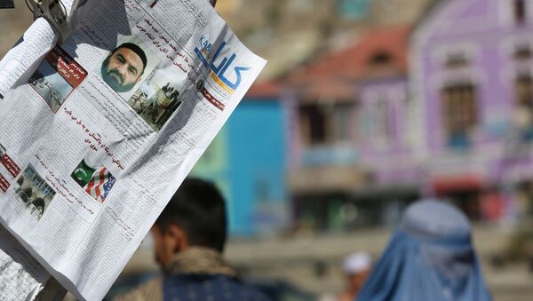 Newspapers hang for sale at a stand carrying headlines about the former leader of the Afghan Taliban, Mullah Akhtar Mansoor, who was killed in a U.S. drone strike last week, in Kabul, Afghanistan, Wednesday, May 25, 2016 - Sputnik International