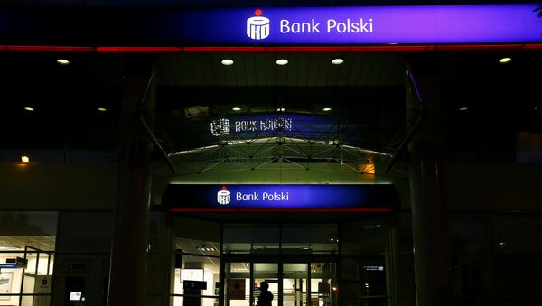 A woman walks outside an entrance to the PKO BP bank headquarters, Poland's largest lender, in Warsaw, Poland May 6, 2016 - Sputnik International