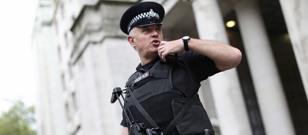 An armed police officer speaks on his radio as he patrols near the Ministry of Defence in London, Britain May 11, 2016 An armed police officer speaks on his radio as he patrols near the Ministry of Defence in London, Britain May 11, 2016 - Sputnik International