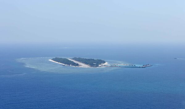 An aerial photo taken though a glass window of a Taiwanese military plane shows the view of Itu Aba, which the Taiwanese call Taiping, at the South China Sea, March 23, 2016 An aerial photo taken though a glass window of a Taiwanese military plane shows the view of Itu Aba, which the Taiwanese call Taiping, at the South China Sea, March 23, 2016 - Sputnik International
