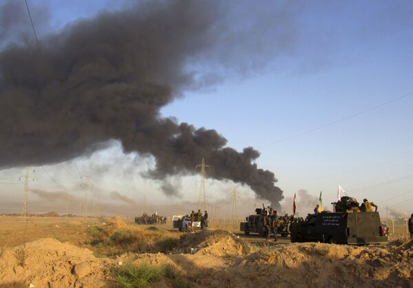 Smoke rises from Islamic State group positions after an airstrike by U.S.-led coalition warplanes in Fallujah, as Iraqi security forces and allied Shiite Popular Mobilization Forces and Sunni tribal fighters, take combat positions outside Fallujah, 40 miles (65 kilometers) west of Baghdad, Iraq, Monday, May 23, 2016 Smoke rises from Islamic State group positions after an airstrike by U.S.-led coalition warplanes in Fallujah, as Iraqi security forces and allied Shiite Popular Mobilization Forces and Sunni tribal fighters, take combat positions outside Fallujah, 40 miles (65 kilometers) west of Baghdad, Iraq, Monday, May 23, 2016 - Sputnik International