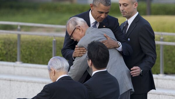 U.S. President Barack Obama hugs Shigeaki Mori, an atomic bomb survivor and a creator of the memorial for American WWII POWs killed in Hiroshima, during a ceremony at Hiroshima Peace Memorial Park in Hiroshima, western, Japan, Friday, May 27, 2016. Obama on Friday became the first sitting U.S. president to visit the site of the world's first atomic bomb attack, bringing global attention both to survivors and to his unfulfilled vision of a world without nuclear weapons. - Sputnik International