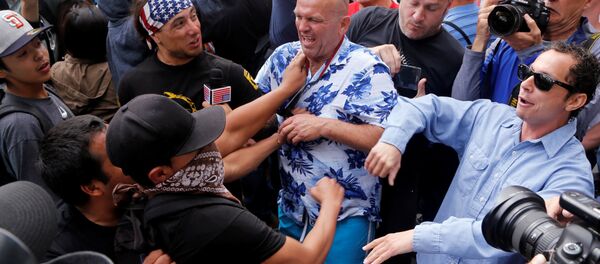Trump supporters and anti-Trump demonstrators clash outside a campaign event for U.S. presidential candidate Donald Trump in San Diego, California, U.S. May 27, 2016. - Sputnik International