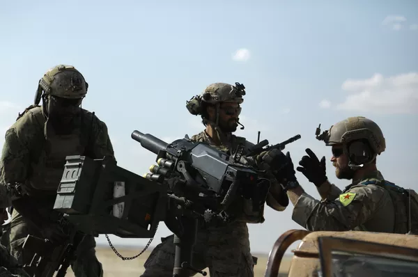 Men in uniform identified by Syrian Democratic forces as US special operations forces as they ride in the back of a pickup truck in the village of Fatisah in the northern Syrian province of Raqa. (File) Men in uniform identified by Syrian Democratic forces as US special operations forces as they ride in the back of a pickup truck in the village of Fatisah in the northern Syrian province of Raqa. (File) - Sputnik International