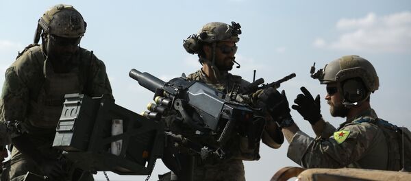 Men in uniform identified by Syrian Democratic forces as US special operations forces as they ride in the back of a pickup truck in the village of Fatisah in the northern Syrian province of Raqa. (File) Men in uniform identified by Syrian Democratic forces as US special operations forces as they ride in the back of a pickup truck in the village of Fatisah in the northern Syrian province of Raqa. (File) - Sputnik International