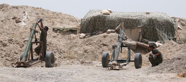 Fighters of the Syria Democratic Forces prepare to fire a mortar shell towards positions held by Islamic State fighters in northern province of Raqqa. Fighters of the Syria Democratic Forces prepare to fire a mortar shell towards positions held by Islamic State fighters in northern province of Raqqa. - Sputnik International