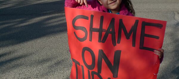 A child demonstrator holding the 'Shame on Turkey' sign. A child demonstrator holding the 'Shame on Turkey' sign. - Sputnik International