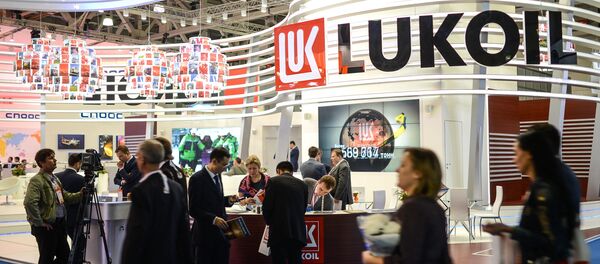 Visitors near the Lukoil display at the World Petroleum Exhibition held at Crocus Expo International Exhibition Center. File photo Visitors near the Lukoil display at the World Petroleum Exhibition held at Crocus Expo International Exhibition Center. File photo - Sputnik International