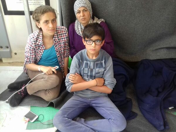 Refugees at the migrants camp in Chios, Greece. Refugees at the migrants camp in Chios, Greece. - Sputnik International