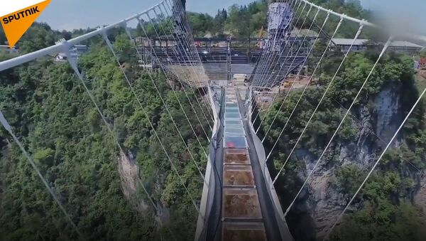 A Challenge for the Brave: World's Longest Glass Bottom Suspension Bridge - Sputnik International
