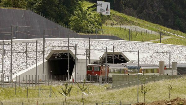 A train drives past the northern gates of the NEAT Gotthard Base Tunnel near the town of Erstfeld, Switzerland March 31, 2016 - Sputnik International