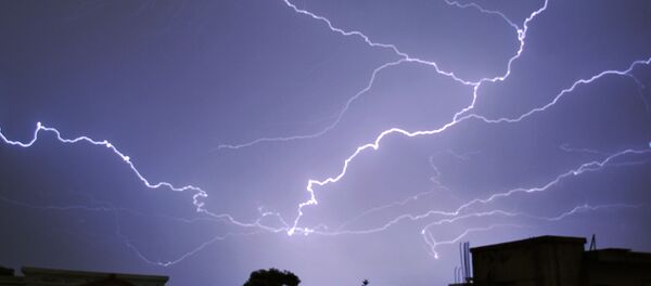Lightning breaks during a thunderstorm in the Pakistani capital Islamabad on June 1, 2016 - Sputnik International