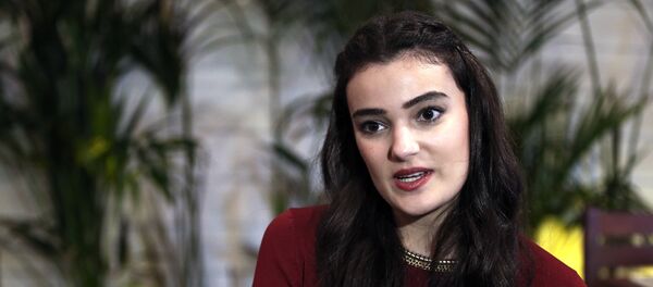 In this Thursday, Feb. 26, 2015 file photo, former Miss Turkey Merve Buyuksarac speaks to The Associated Press in Istanbul, Turkey In this Thursday, Feb. 26, 2015 file photo, former Miss Turkey Merve Buyuksarac speaks to The Associated Press in Istanbul, Turkey - Sputnik International