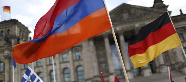 Supporters wave Armenian and German flags in front of the Reichstag, the seat of the lower house of parliament Bundestag in Berlin, Germany, June 2, 2016, as they protest in favour of approval of a symbolic resolution by Germany's parliament that declares the 1915 massacre of Armenians by Ottoman forces a genocide Supporters wave Armenian and German flags in front of the Reichstag, the seat of the lower house of parliament Bundestag in Berlin, Germany, June 2, 2016, as they protest in favour of approval of a symbolic resolution by Germany's parliament that declares the 1915 massacre of Armenians by Ottoman forces a genocide - Sputnik International