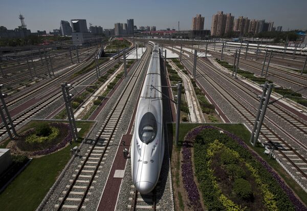 A CRH high-speed train leaves the Beijing South Station in Beijing, China, Tuesday, July 26, 2011 - Sputnik International