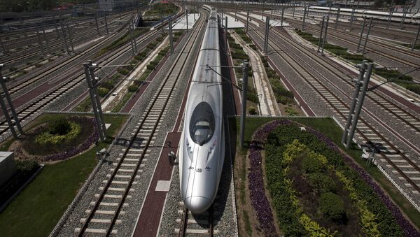 A CRH high-speed train leaves the Beijing South Station in Beijing, China, Tuesday, July 26, 2011 - Sputnik International