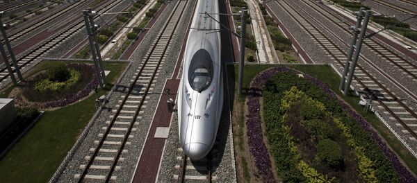 A CRH high-speed train leaves the Beijing South Station in Beijing, China, Tuesday, July 26, 2011 A CRH high-speed train leaves the Beijing South Station in Beijing, China, Tuesday, July 26, 2011 - Sputnik International