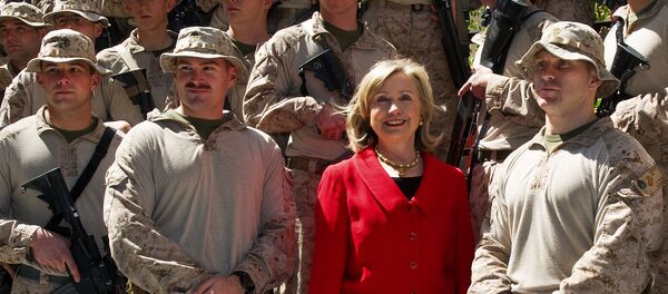 US Secretary of State Hillary Clinton poses for a photograph with members of the USMC FAST Marines, a quick response team from Norfolk, Virginia, on duty at the US Embassy in Cairo, on March 16, 2011 - Sputnik International