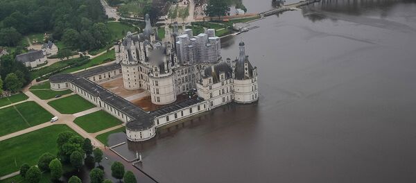 An aerial picture taken on June 2, 2016 shows the castle of Chambord, some 170 kilometers southwest of Paris, and its partly flooded park after the river Cosson went bursting it banks following heavy rainfalls - Sputnik International