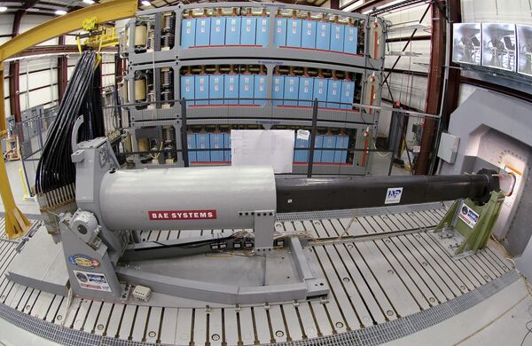 This Thursday Feb. 23. 2012 photo provided by the US Navy shows engineers at Naval Surface Warfare Center, Dahlgren Division, prepare to test the Office of Naval Research-funded electromagnetic railgun prototype launcher that was recently installed at a test facility in Dahlgren, Va. This Thursday Feb. 23. 2012 photo provided by the US Navy shows engineers at Naval Surface Warfare Center, Dahlgren Division, prepare to test the Office of Naval Research-funded electromagnetic railgun prototype launcher that was recently installed at a test facility in Dahlgren, Va. - Sputnik International