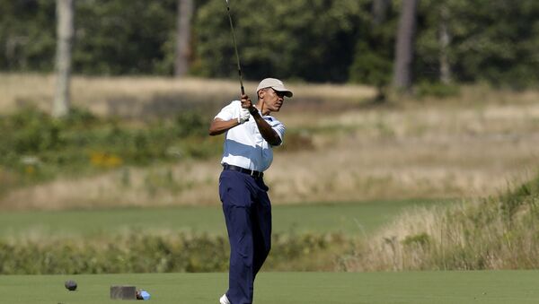 President Barack Obama watches the flight of his ball as he tees off while golfing at Vineyard Golf Club, in Edgartown, Mass - Sputnik International