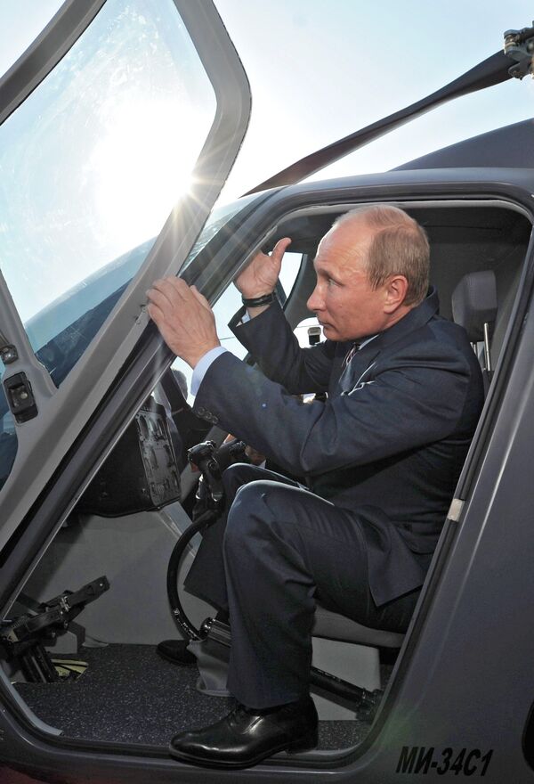 Russian President Vladimir Putin seen in the cockpit of the Mi-34 helicopter exhibited by the Russian Helicopters manufacturer. (File) Russian President Vladimir Putin seen in the cockpit of the Mi-34 helicopter exhibited by the Russian Helicopters manufacturer. (File) - Sputnik International