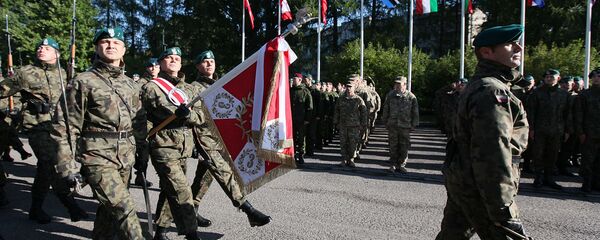 The Honorary Company of the Polish army walks in front of troops that will take part in major international Anakonda-14 defense exercise during the opening ceremony at the National Defense Academy in Warsaw-Rembertow district, Wednesday, Sept. 24, 2014 - Sputnik International