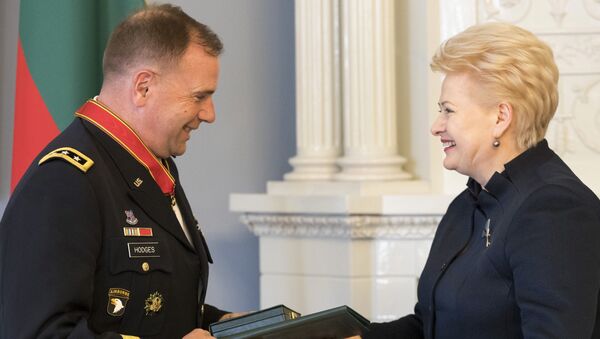 Lithuanian President Dalia Grybauskaite, right, presents the State Awards of the Republic of Lithuania, the Cross of Commander of the Order for Merits to Lithuania, to Commander of U.S. Army Europe Lt. Gen. Ben Hodges during a ceremony at the President's palace in Vilnius, Lithuania - Sputnik International