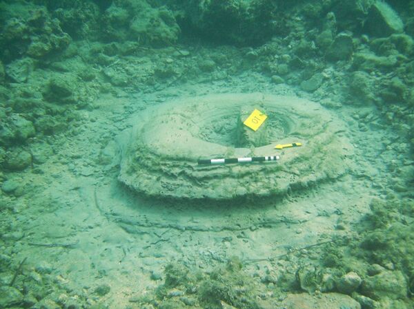 There were what superficially looked like circular column bases, and paved floors. - Sputnik International