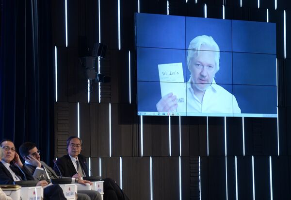 A video link up with Julian Assange, journalist, founder and editor-in-chief of WikiLeaks, at the session, End of the Monopoly: The Open Information Age, held as part of the New Era of Journalism: Farewell to Mainstream international media forum at the Rossiya Segodnya International Multimedia Press Center A video link up with Julian Assange, journalist, founder and editor-in-chief of WikiLeaks, at the session, End of the Monopoly: The Open Information Age, held as part of the New Era of Journalism: Farewell to Mainstream international media forum at the Rossiya Segodnya International Multimedia Press Center - Sputnik International