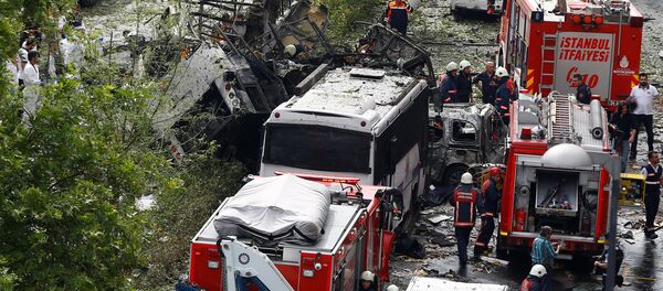 Forensic experts (L) and firefighters stand beside a Turkish police bus which was targeted in a bomb attack in a central Istanbul district, Turkey, June 7, 2016. Forensic experts (L) and firefighters stand beside a Turkish police bus which was targeted in a bomb attack in a central Istanbul district, Turkey, June 7, 2016. - Sputnik International