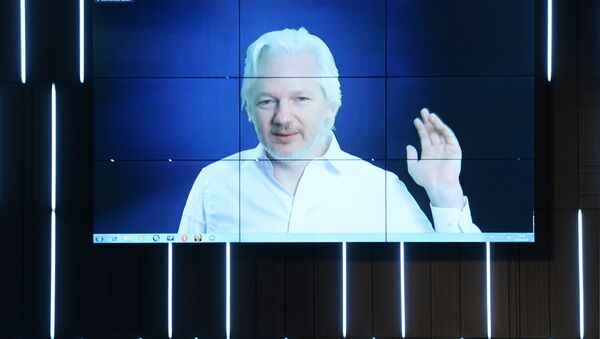 A video link up with Julian Assange, journalist, founder and editor-in-chief of WikiLeaks, at the session, End of the Monopoly: The Open Information Age, held as part of the New Era of Journalism: Farewell to Mainstream international media forum at the Rossiya Segodnya International Multimedia Press Center - Sputnik International