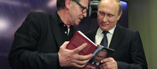 June 7, 2016. Right: Russian President Vladimir Putin, right, during presentation of the book Putin: the Logic of Power by German journalist Hubert Seipel during the International Media Forum New Era of Journalism: Farewell to Mainstream. at the International Multimedia Press Center of the Rossiya Segodnya International Information Agency. Left: Hubert Seipel, a journalist with Germany's ARD / NDR television & radio companies. - Sputnik International