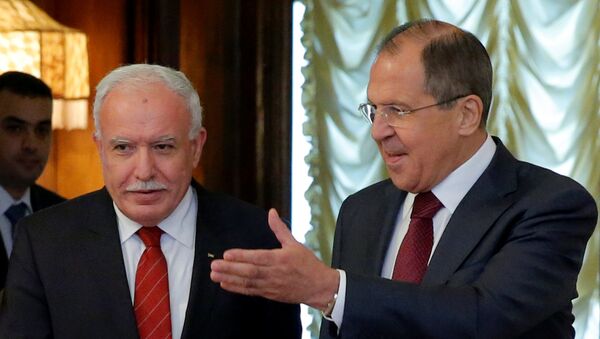 Russian Foreign Minister Sergei Lavrov (R) shows the way to his Palestinian counterpart Riyad al-Maliki during a meeting in Moscow, Russia June 8, 2016. - Sputnik International