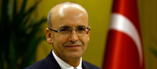 Turkish Deputy Prime Minister Mehmet Simsek poses during an interview with Reuters in Ankara, Turkey. Turkish Deputy Prime Minister Mehmet Simsek poses during an interview with Reuters in Ankara, Turkey. - Sputnik International