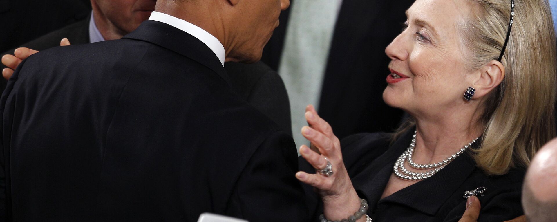 Former Secretary of State Hillary Rodham Clinton greets President Barack Obama after he delivered his State of the Union address on Capitol Hill in Washington. - Sputnik International, 1920, 28.07.2020