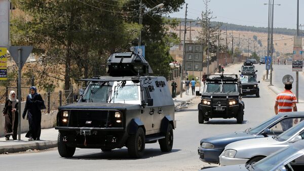Jordanian security vehicles seen near the General Intelligence directorate offices near al Baqaa Refugee Camp, north of Amman, Jordan, June 6, 2016 - Sputnik International