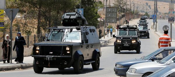Jordanian security vehicles seen near the General Intelligence directorate offices near al Baqaa Refugee Camp, north of Amman, Jordan, June 6, 2016 - Sputnik International