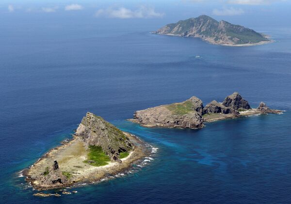 A group of disputed islands, Uotsuri island (top), Minamikojima (bottom) and Kitakojima, known as Senkaku in Japan and Diaoyu in China is seen in the East China Sea (File) A group of disputed islands, Uotsuri island (top), Minamikojima (bottom) and Kitakojima, known as Senkaku in Japan and Diaoyu in China is seen in the East China Sea (File) - Sputnik International