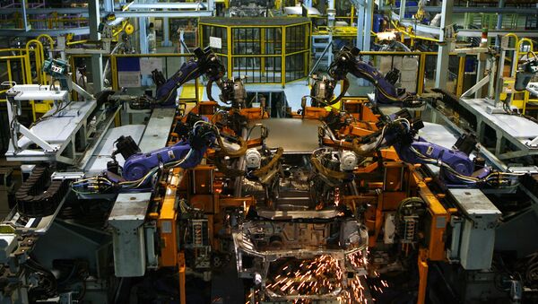 Sparks fly from a robot as it performs spot welding on a car on the production line at Honda Siel Cars India Ltd. (HSCI) factory in Noida, a satelite town on the outskirts of New Delhi on February 25, 2008 - Sputnik International